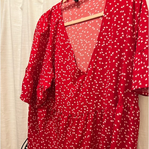 Red dress with white hearts and ruffles on the bottom part of dress. - Picture 2 of 5